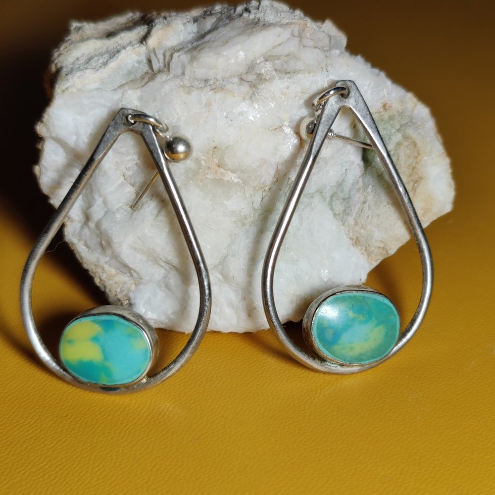 Sterling hoop earrings with green stone
